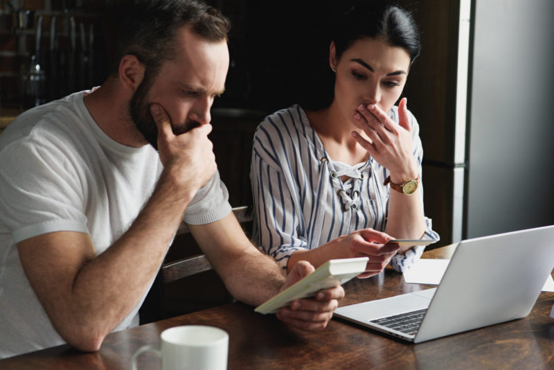 Two people considering tax